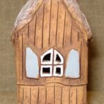 Žvakidė "Namelis ant vištos kojelės"